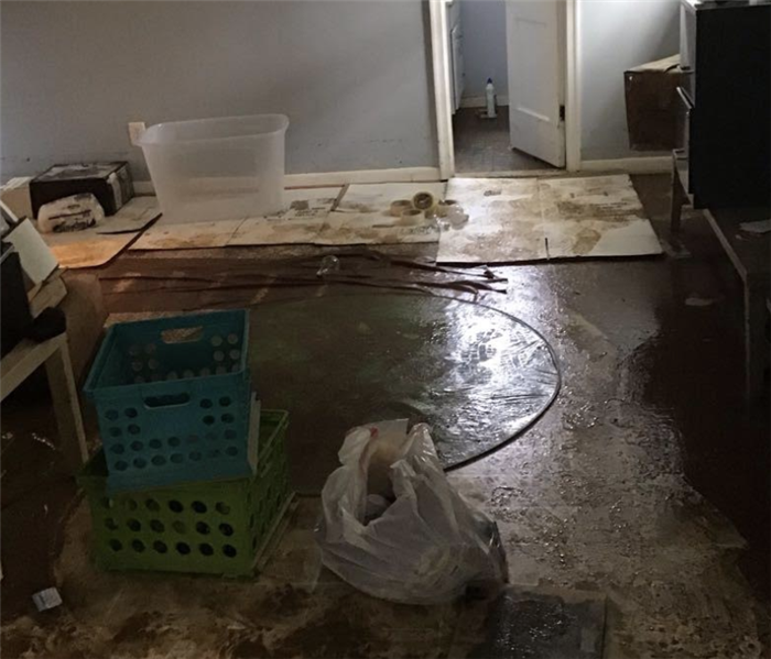 a room with mud and water on the ground