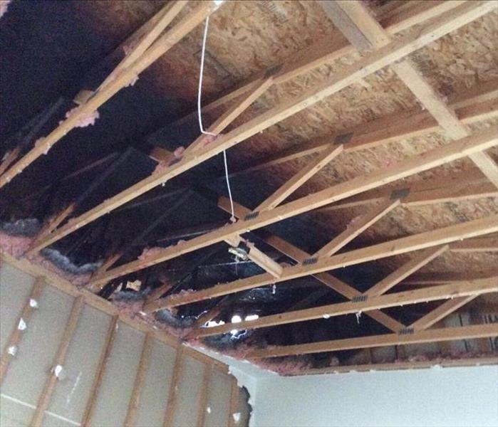 Fire damaged ceiling and walls.