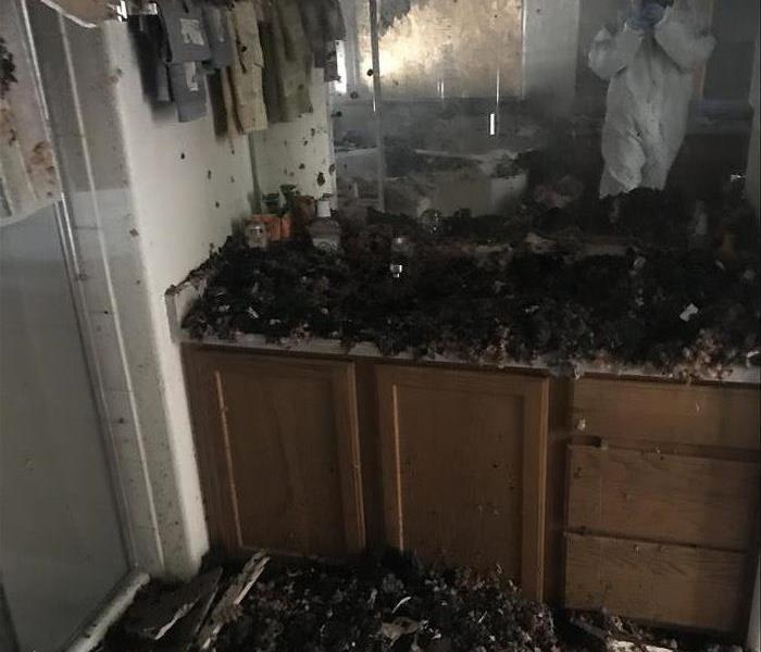 Severe fire damage in a bathroom.