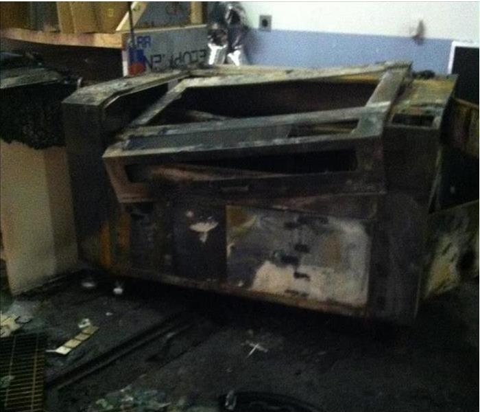 Printer severely damaged by a fire.